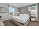 Bright bedroom with a large bed, decorative wallpaper, and sheer curtains at 4530 Narrative Ln, Kissimmee, FL 34746
