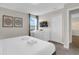 Bright bedroom with sleek furnishings and an entertainment setup at 4530 Narrative Ln, Kissimmee, FL 34746