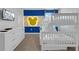 Charming bunk bedroom with a bright accent wall and playful decor at 4530 Narrative Ln, Kissimmee, FL 34746