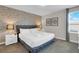 Stylish bedroom featuring an accent wall and cozy furnishings at 4530 Narrative Ln, Kissimmee, FL 34746