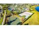 Aerial view showcasing a community's waterpark, volleyball court, basketball court, and clubhouse at 4530 Narrative Ln, Kissimmee, FL 34746