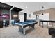 Game room featuring a pool table, TV screens, and bar seating area at 4530 Narrative Ln, Kissimmee, FL 34746