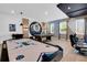 Spacious game room featuring an air hockey table, pool table, and stylish decor at 4530 Narrative Ln, Kissimmee, FL 34746