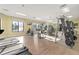 Fitness center with treadmills, weights, and television sets at 4530 Narrative Ln, Kissimmee, FL 34746