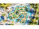 Aerial view of water park area, including the lazy river, water slides, mini golf, and lush landscaping at 4530 Narrative Ln, Kissimmee, FL 34746