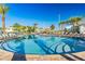 Stunning community pool with lounge chairs and clear blue water for relaxing on hot days at 4530 Narrative Ln, Kissimmee, FL 34746