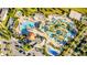 Aerial view of luxurious resort-style pool, playground, and splash pad at 4530 Narrative Ln, Kissimmee, FL 34746