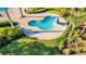 A kidney-shaped kiddie pool is surrounded by lush landscaping at 4530 Narrative Ln, Kissimmee, FL 34746