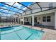 Beautiful outdoor pool and spa area features sun loungers and ample space to relax at 4530 Narrative Ln, Kissimmee, FL 34746