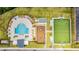 Overhead view of the community pool with sports field and playground; perfect for active residents at 4530 Narrative Ln, Kissimmee, FL 34746