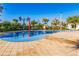 Community splash pad with colorful fountains on a blue rubber surface surrounded by brick pavers at 4530 Narrative Ln, Kissimmee, FL 34746