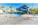 Community waterslide with attached pool and patio feature for cooling off on hot days at 4530 Narrative Ln, Kissimmee, FL 34746