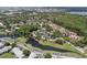 Aerial view showcasing a community with lush green spaces and a serene pond amenity at 5083 Eaglesmere Dr # A12, Orlando, FL 32819