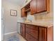 Additional view of the kitchen with updated cabinets, granite countertops, and stainless steel dishwasher at 5083 Eaglesmere Dr # A12, Orlando, FL 32819