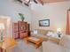 Bright living room with vaulted ceilings, tile floors, and comfortable seating at 5083 Eaglesmere Dr # A12, Orlando, FL 32819