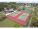 Aerial view of community tennis courts, showcasing well-maintained surfaces and surrounding greenery at 5083 Eaglesmere Dr # A12, Orlando, FL 32819