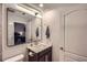 This bathroom has a modern style vanity with a large mirror to give space to the room at 524 Lanark Ct, Orlando, FL 32806