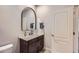 Bathroom showcasing a vanity with marble countertop, dark wood cabinets, and a vessel sink at 524 Lanark Ct, Orlando, FL 32806