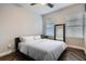 This bedroom features a ceiling fan, wooden flooring, and natural light from the windows at 524 Lanark Ct, Orlando, FL 32806