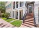 Charming townhome exterior showcasing brick steps, a welcoming entrance, and well-maintained landscaping at 524 Lanark Ct, Orlando, FL 32806