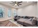 Comfortable living room featuring a large sectional sofa, stylish rug, and abundant natural light at 524 Lanark Ct, Orlando, FL 32806