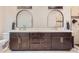 Stylish main bathroom featuring dual sinks, a walk-in shower, and updated fixtures at 524 Lanark Ct, Orlando, FL 32806