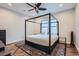 A serene primary bedroom featuring a four-poster bed, a ceiling fan, and modern decor at 524 Lanark Ct, Orlando, FL 32806