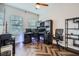 This office has natural lighting, herringbone floors, and an ergonomic black chair at 524 Lanark Ct, Orlando, FL 32806