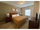 Comfortable bedroom with queen-sized bed, neutral decor, and natural lighting at 5370 Diplomat Ct # 107, Kissimmee, FL 34746