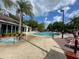 Resort-style pool area featuring a jacuzzi, lounge chairs, and a sunny patio for ultimate relaxation at 5370 Diplomat Ct # 107, Kissimmee, FL 34746