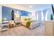 Charming bedroom featuring a king bed with playful wall decor at 665 Longboat Dr, Davenport, FL 33896