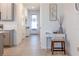 Bright hallway with tile floors and a charming foyer table at 665 Longboat Dr, Davenport, FL 33896