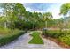 Enjoy the community's mini golf area surrounded by landscaping and mature trees at 665 Longboat Dr, Davenport, FL 33896