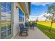 Outdoor patio area with patio furniture overlooking a green lawn at 665 Longboat Dr, Davenport, FL 33896