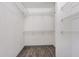 Walk-in closet with shelving for storage and organization at 685 Middlebury Loop, New Smyrna Beach, FL 32168