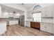 Spacious kitchen features white cabinets, granite countertops, stainless steel appliances, and stylish backsplash at 685 Middlebury Loop, New Smyrna Beach, FL 32168