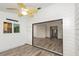 This open living room features shiplap walls, wood-look floors, neutral paint, and access to the kitchen at 685 Middlebury Loop, New Smyrna Beach, FL 32168