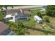 Drone view of the property with a screened pool, solar panels, and RV parking at 6906 Sawmill Blvd, Ocoee, FL 34761