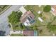 Aerial view showcasing a pool, large yard, and proximity to neighborhood at 6906 Sawmill Blvd, Ocoee, FL 34761