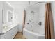 Bathroom features a corner soaking tub, a shower head, and a long vanity at 6906 Sawmill Blvd, Ocoee, FL 34761