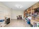 Bonus room with shelves full of books, built in desk space and comfortable seating at 6906 Sawmill Blvd, Ocoee, FL 34761