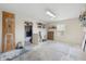 Spacious garage features overhead lighting, and shelving for organized storage solutions at 6906 Sawmill Blvd, Ocoee, FL 34761