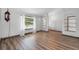 Spacious living room featuring beautiful hardwood flooring and plenty of natural light at 6906 Sawmill Blvd, Ocoee, FL 34761