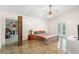 Bedroom with unique flooring, ceiling fan and an open closet area at 6906 Sawmill Blvd, Ocoee, FL 34761