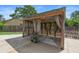 Outdoor pergola with curtains, offers a stylish and shaded space for relaxation and entertaining at 6906 Sawmill Blvd, Ocoee, FL 34761