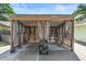 Backyard pergola on a concrete patio, offers a shaded and stylish outdoor retreat at 6906 Sawmill Blvd, Ocoee, FL 34761
