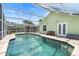 Backyard pool with screened-in enclosure and patio provides a perfect space for relaxation at 6906 Sawmill Blvd, Ocoee, FL 34761