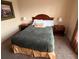Cozy bedroom with a comfortable bed, two lamps, and two nightstands at 8020 Tuscany Way # 6307, Davenport, FL 33896