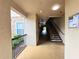 Exterior hallway with tile floors leading to stairs and a view of the landscape at 8020 Tuscany Way # 6307, Davenport, FL 33896