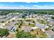 Enjoy an aerial view of this community, showcasing the neighborhood layout and green spaces at 804 Glen Creek Ct, Fruitland Park, FL 34731